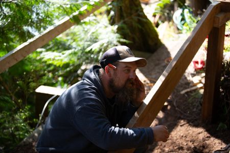 Carl Hernandez helps construct a ramp on his neighbor's property. (National Geographic/Mickey Ramos)