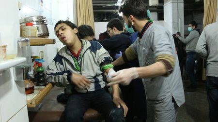 Al Ghouta, Syria - Young boy receives medical treatment in the emergency room. (National Geographic)