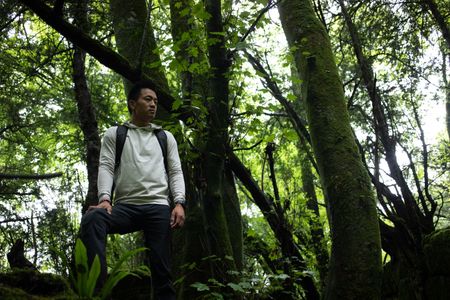 Coleford, UK - Albert Lin in a forest in Coleford, UK. (National Geographic/Hugh Campbell)