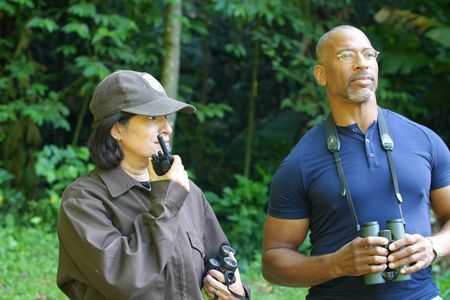 Christian Cooper observes the historic release of 7 Puerto Rican Parrots into the wild with Marisel López-Flores Lopez, the Project Leader of the Puerto Rican Parrot Recovery Program. (National Geographic for Disney)