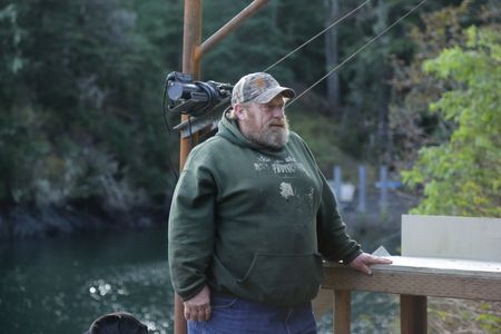 Tim 'Curly' Leach uses a hoist to get a deer up to his property. (National Geographic/Mickey Ramos)