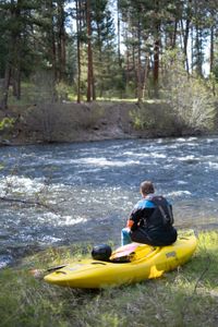 Professional kayaker Ben Stookesberry sits on his kayak and observes the water.  (National Geographic/Harrison Gayton)