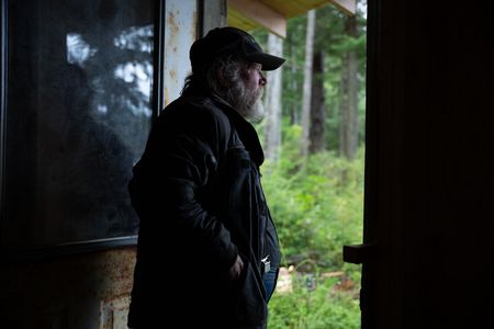 Terry Simpson is grateful for his neighbors' help in building him a new cabin. (National Geographic/Robert Jolley)