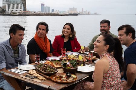 Guests around the table at the final cook in Cuba. (National Geographic/Justin Mandel)