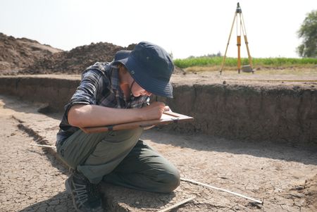 Sara Gebhardt takes measurements at the Pi Ramesses dig site in Egypt. (Windfall Films)