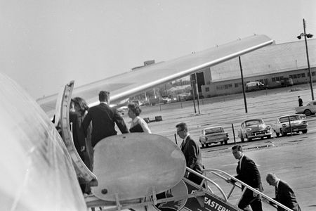 Jacqueline Kennedy and other members of the Presidential party including Lawrence O'Brien, Kenneth O'Donnell, General Clifton, and Dave Powers, prepare to board Air Force One after President John F. Kennedy's casket was carried onto the plane at Love Field in Dallas, Nov. 22, 1963. (Cecil Stoughton/White House Photographs/John F. Kennedy Presidential Library and Museum, Boston)