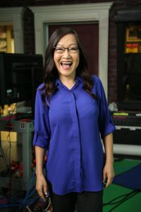 Helen Hong standing with an elated wide smile. (National Geographic/Robert Toth)