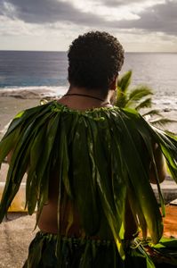 A Takalo warriors awaits the arrival of the National Geographic Pristine Seas expedition team. National Geographic Pristine Seas explored the marine ecosystem in Niue -a small island nation in the tropical Pacific. Local and international scientists surveyed the ocean to understand its health and biodiversity. Thanks to local leadership, traditional knowledge, and strong science, the country has been able to protect large swaths of its marine environment. (National Geographic/Nova West)