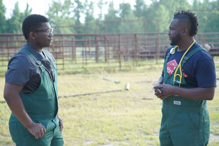Dr. Hodges and his son, VJ, have a quick discussion at V Squared Ranch. (National Geographic for Disney/Nicholas Reaves)
