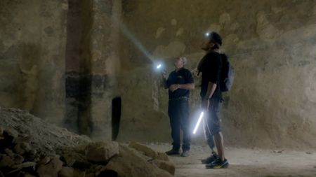 Acre, Israel - Albert Lin (R) with Eliezer Stern in an underground crypt. (National Geographic)