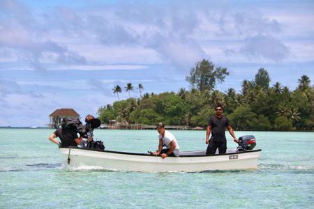 Dr. Albert Lin and the crew get into position for filming on the reef where the ancient city of Nan Madol was built. (National Geographic/Blakeway Productions)