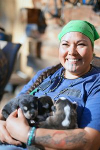 Jody Potts-Joseph with her puppies. (National Geographic/Ashton Hurlburt)
