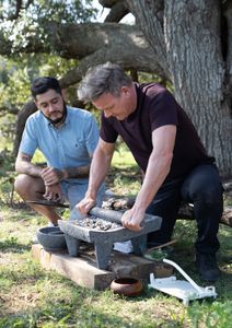 TX - Emmanuel Chavez (L), a local chef, teaches Gordon Ramsay (R) how to make the perfect masa, a dough made of corn. (Credit: National Geographic/Justin Mandel)