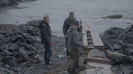 Sarah McDonald, David Squibb, and Troy Brockway construct a ramp from the beach up to Troy's property. (National Geographic/Gil Cano)