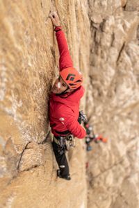Alex Honnold climbing the Pool Wall after being hit on the nose by a piece of ice.  (photo credit: National Geographic/Pablo Durana)