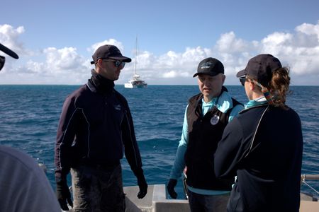 Charlie Huveneers Adam Barnett and Lauren Meyer in discussion. (National Geographic/Sophy Crane)