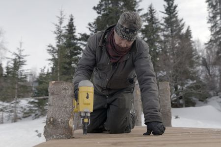 Joel Jacko builds a dock in the winter season. (National Geographic/Wayne Shockey)