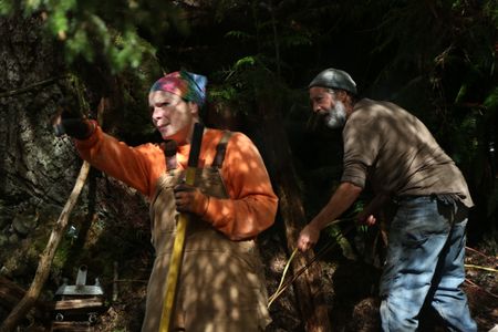 Veronica Arrants gets help from her neighbor Dave Palmer with clearing dangerous trees from her property. (National Geographic/Wayne Moss)