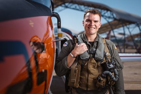 Student LTJG Dylan Horan poses next to a T-45. (National Geographic/Freddie Claire)