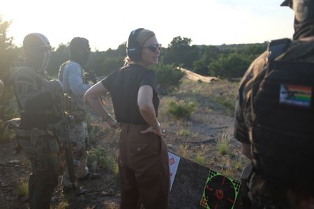 Mariana van Zeller stands with members of the Black Cat Rifle Group. (National Geographic)