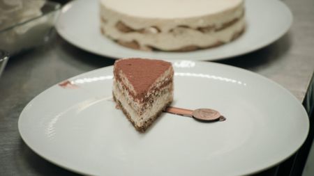 TUCCI IN ITALY - “Veneto” - A slice of tiramisù on a white plate. (National Geographic)TUCCI IN ITALY