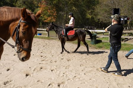 Behind-the-scenes as crew films Debbie St. John riding a horse in 9/11 Reunited. (National Geographic/Virginia Sherwood)