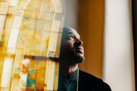 Rev. Robert Turner leads the Historic Vernon AME Church in the Greenwood District of Tulsa. The church was the only building that remained intact during the 1921 Tulsa Race Massacre. (Bethany Mollenkof/National Geographic)