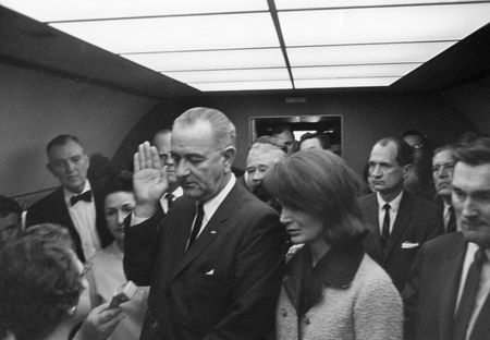 Lyndon B. Johnson is sworn in as President of the United States during ceremony aboard Air Force One, Nov. 22, 1963, in Dallas. Former first lady Jacqueline Kennedy stood beside him during the ceremony. (Cecil Stoughton/White House Photographs/John F. Kennedy Presidential Library and Museum, Boston)
