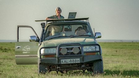 Elephant expert Joyce Poole poses for a photo. She has studied elephants for almost 5 decades and along with her husband has created the elephant ethogram, the first comprehensive library of thousands of elephant behaviors. There's nothing like this for any other species on earth. (National Geographic for Disney/Wim Vorster)