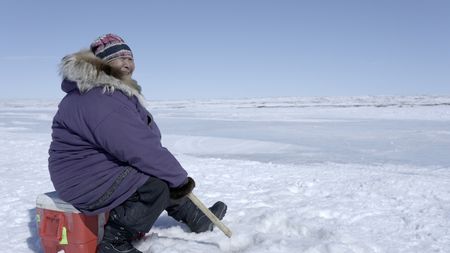 Teresa Pingayak ice fishing. (National Geographic/Matt Kynoch)