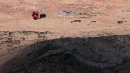 Alex Honnold free solos Les Rivieres Pourpres.  (photo credit: National Geographic)