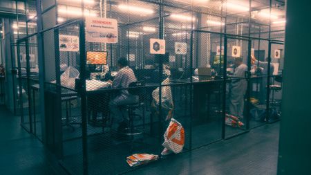 Fidelity workers count cash in Johannesburg, South Africa. (National Geographic)