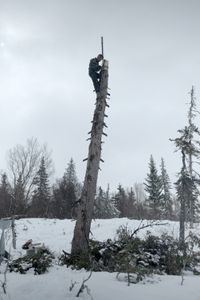 Joel Jacko installs a windmill on his property for additional power. (National Geographic/Wayne Shockey)