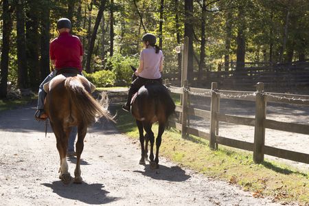Stefan Horlacher and Debbie St. John ride horses together during their reunion. (National Geographic/Virginia Sherwood)