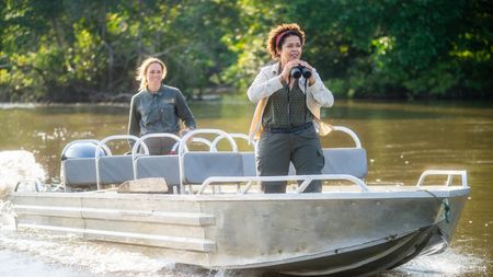 Paula Kahumbu, elephant expert, and Odzala Discovery Camps guide, Kerri Lee, go in search of finding the elusive forest elephants in Odzala National Park, Republic of Congo. The forest is very dense, making waterways the easiest form of travel. (National Geographic for Disney/Sebastian Blach)