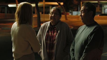 Mariana van Zeller speaks with Deb Dineyazke and Tim Arviso after searching for their son on the streets in Phoenix, Arizona. (National Geographic)
