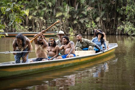 The Waorani people take Professor of Toxicology Bryan Fry, Will Smith and Expedition Leader Carla Perez out on the water to track an anaconda to gather blood and tissue samples.  (credit: National Geographic/Kyle Christy)