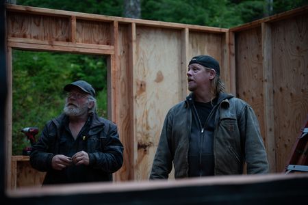 Terry Simpson is grateful for his friend David Squibb's help in building him a new cabin. (National Geographic/Robert Jolley)