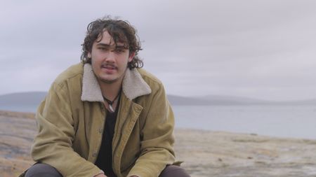 Conner Shirley being interviewed and reflecting on witnessing his friend, Luke Pascoe, being attacked by a shark. (National Geographic)