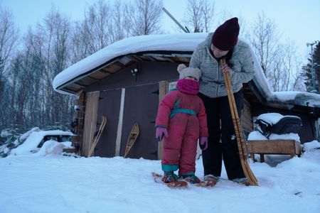 Sonta Roach teaching her daughter Chevelle how to walk across snow in snowshoes. (BBC Studios Reality Productions, LLC/Jayce Kolinski)