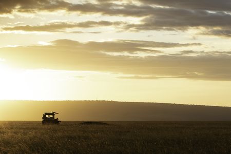 The filming vehicle at dawn in Maasai Mara, Kenya. (National Geographic/Georgie Ward)