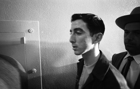 Buell Wesley Frazier is escorted by police at the Dallas Police Department building in Dallas, late 1963. A neighbor of Lee Harvey Oswald, the teenaged Frazier drove Oswald to the Texas Book Depository, from which Oswald assassinated President John F. Kennedy. (Lawrence Schiller/Polaris Communications/Getty Images)