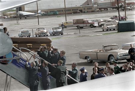 This colorized archival image shows President John F. Kennedy's casket as it is carried onto Air Force One at Love Field, Dallas, Nov. 22, 1963. Onlookers include Lawrence O'Brien, General Clifton, Jacqueline Kennedy, Kenneth O'Donnell, Dave Powers, and Evelyn Lincoln. (Cecil Stoughton/White House Photographs/John F. Kennedy Presidential Library and Museum, Boston)