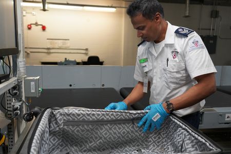 Ash Gobin, Screening Officer, CATSA, in the Baggage area. (Arrow International Media Ltd & Cantina Media)