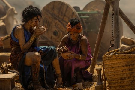 Two women sit together at the Pompeii displacement camp, both covered in ash. (National Geographic/Darrin Zammit Lupi)