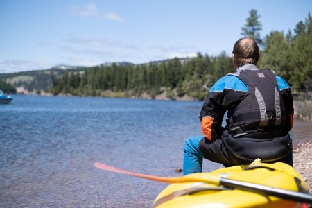 Professional kayaker Ben Stookesberry sits on his kayak and observes the water.  (National Geographic/Harrison Gayton)