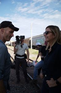 Mariana van Zeller and film crew stand around trains in Culiacán, Mexico. (National Geographic)