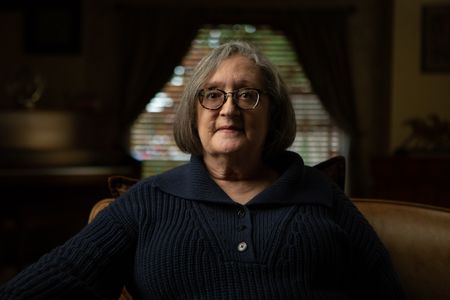 Fran Ferrari is pictured in close-up portrait during the production of National Geographic's Oklahoma City Bombing: One Day In America. Ferrari was at work in the Journal Record building located across the street from the Alfred P. Murrah building and was seriously injured when the explosion shattered the large window in front of her desk. On April 19, 1995, America experienced the deadliest domestic terror attack in its history. Thirty years later, this series tells the story of that day told only by those who lived through it – the people of Oklahoma. (National Geographic/Brandon Widener)