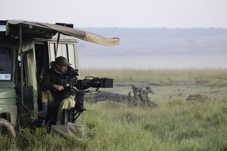 DOP Sophie Darlington films hyenas. (National Geographic/Alice Owen)