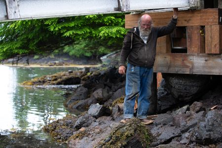 Terry Simpson helps repair a gangway. (National Geographic/Wes Waters)